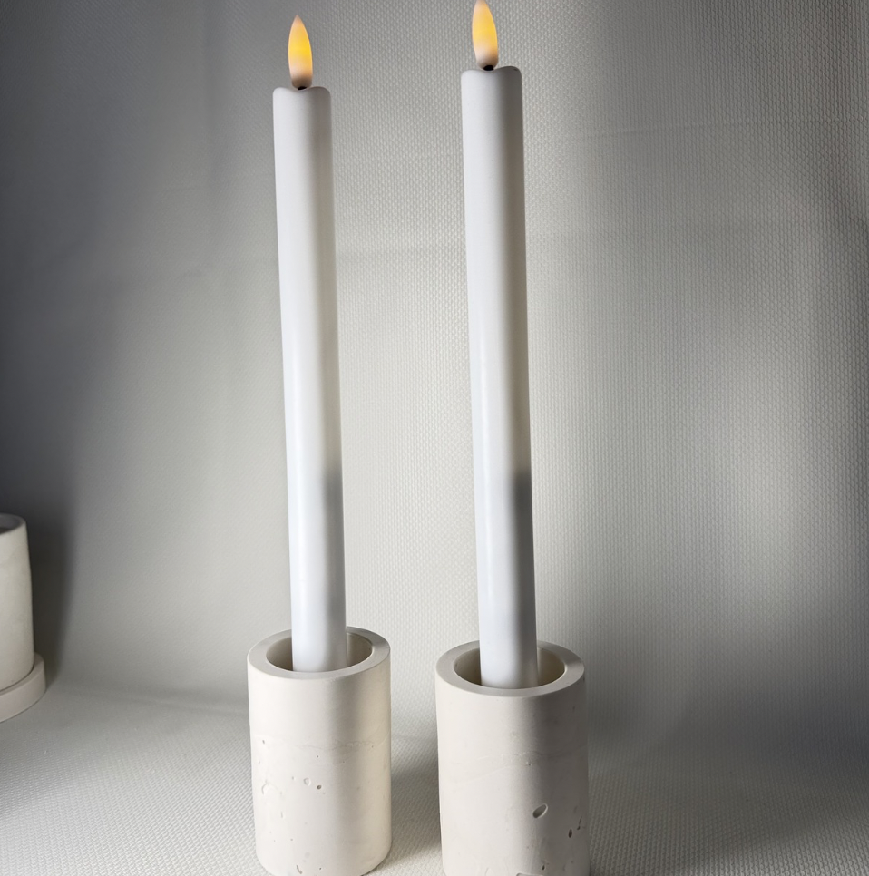 Set of two minimalist handmade candlestick holders in natural tone for calm interiors and flame-free lighting