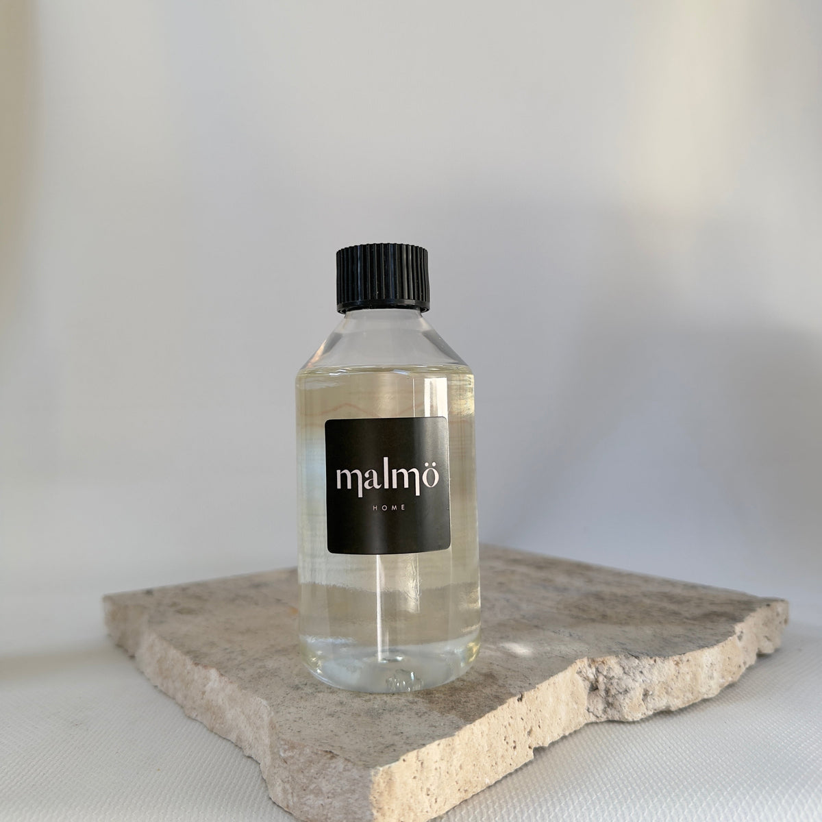 Malmo Home diffuser oil refill, 250ml fragrance oil in recyclable bottle, neutral background