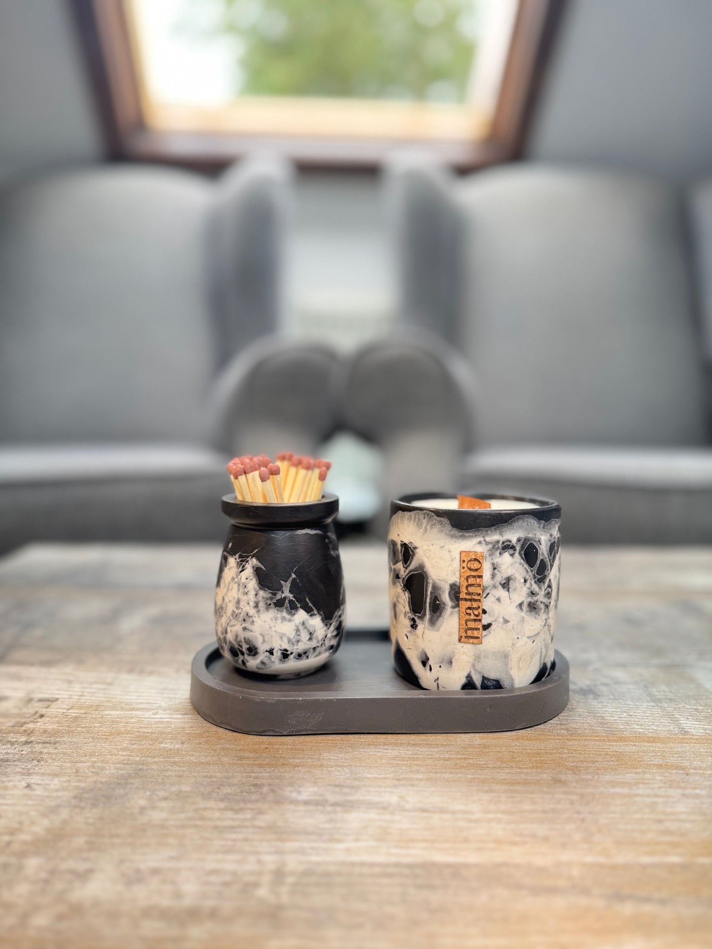 Handcrafted refillable candle pot set with natural and charcoal colors, tray, and match pot by Malmö Home