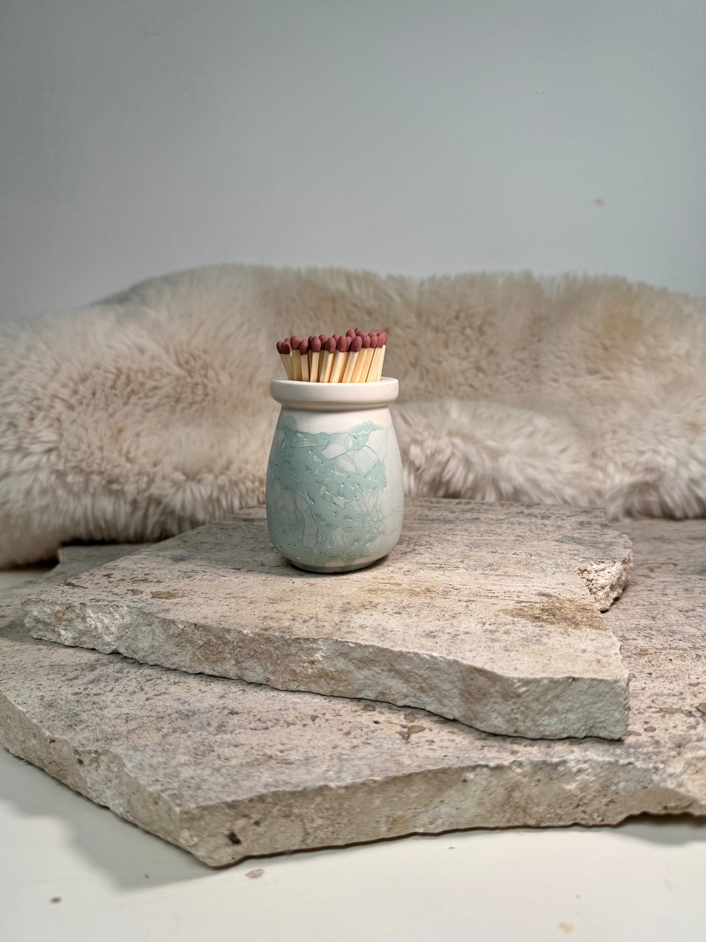 Sage green refillable match pot with matches and striker base by Malmö Home