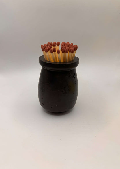 Handcrafted Match Pot, Matches and Striker in Black | UKAll black, this handmade match pot comes complete with: 

Match Pot
Coloured safety matches
Striker card 

Colour: All black rock effect 
Match colour will vary accoCandle MatchesMalmo HomeMalmo HomeHandcrafted Match Pot