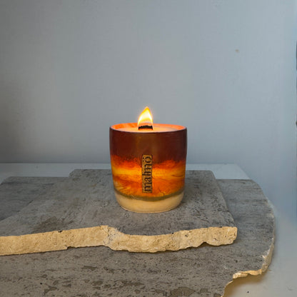 Refillable handmade candle pot from Malmö Home Sun Collection with amber and orange tones