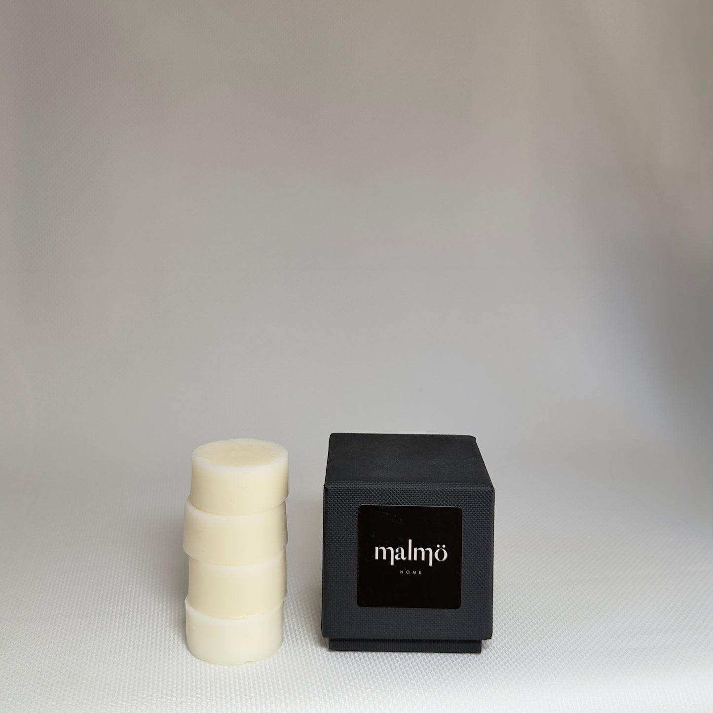 Malmo Home Malmo Moments, close detail of ceramic candle pot and reed diffuser
