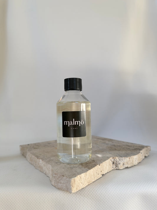 Malmo Home diffuser oil refill, 250ml fragrance oil in recyclable bottle, neutral background
