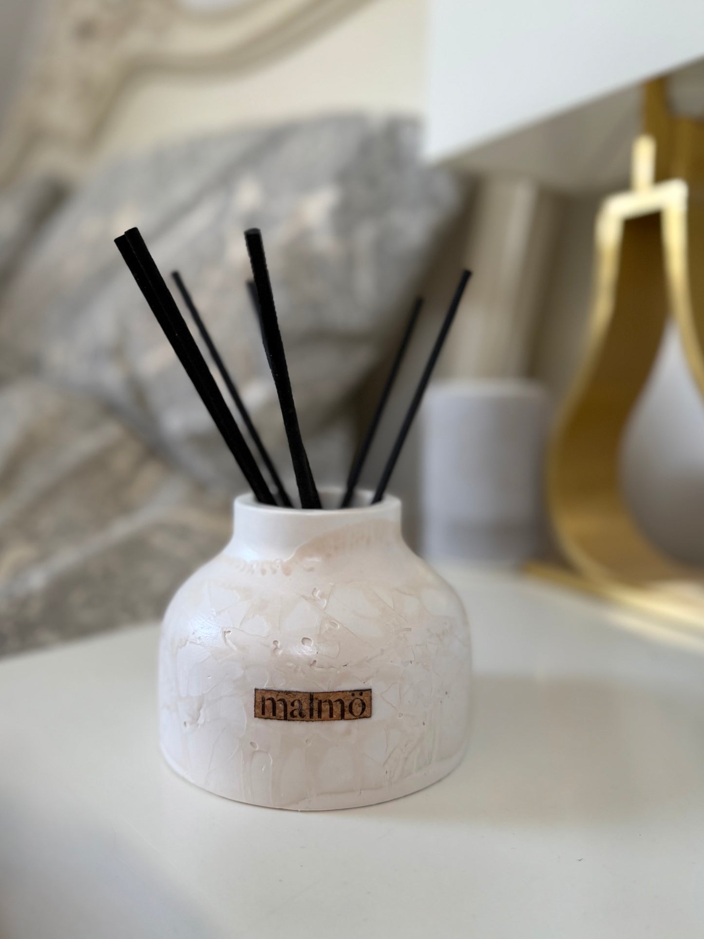 Malmo Home Natural Drom diffuser, close detail of ceramic neck and reed stems
