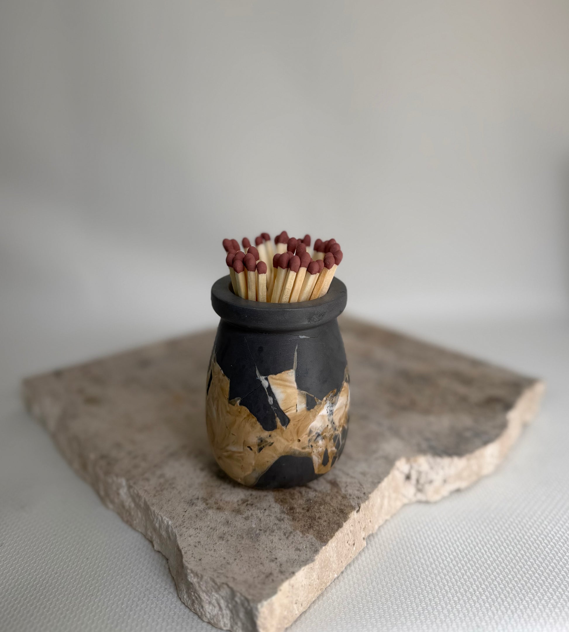 Malmo Home refillable match pot in charcoal, beige and natural, grouped flat lay

