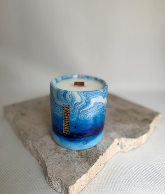 Malmo Home Sky candle pot, pale blue stone-effect ceramic, top-down view
