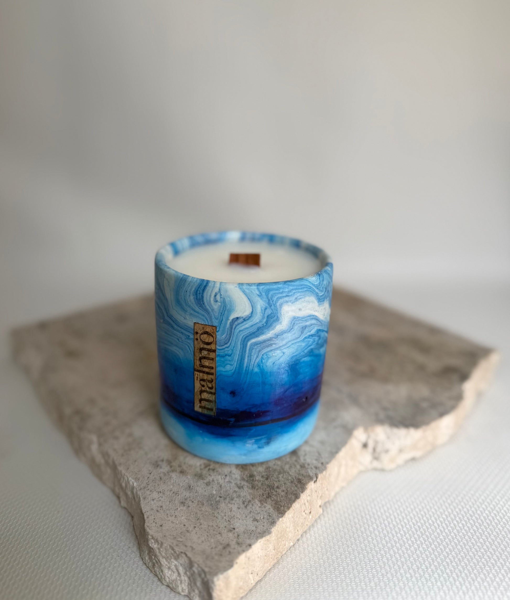 Malmo Home Sky candle pot, close detail of pale blue stone-effect glaze

