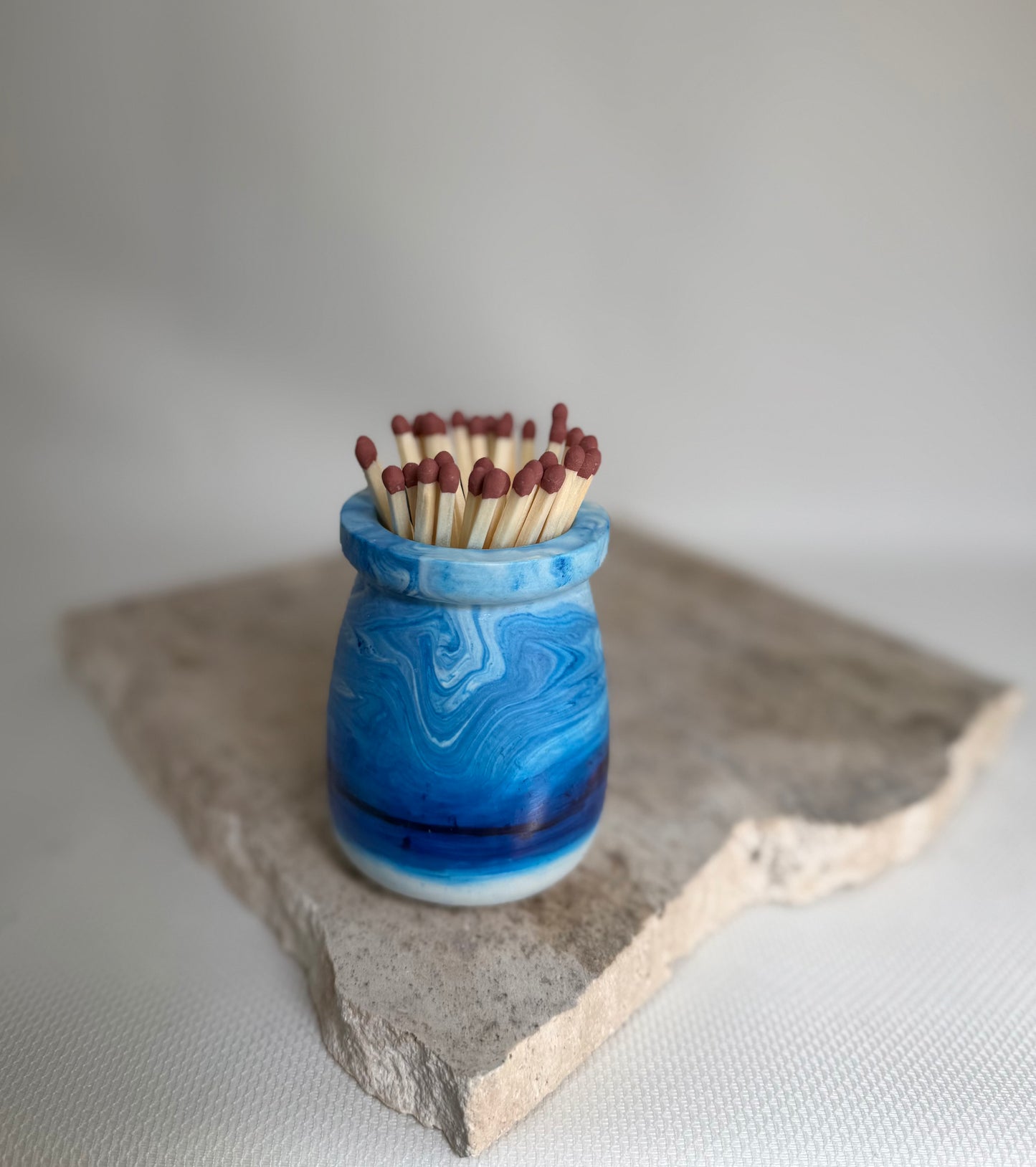 
Malmo Home Sky match pot, pale blue stone-effect ceramic with long safety matches, top view
