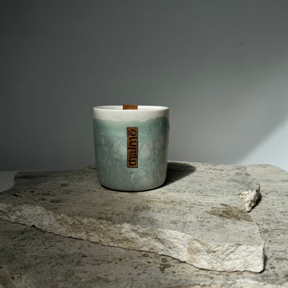 Sage green single pot refillable candle with natural rock effect by Malmö Home
