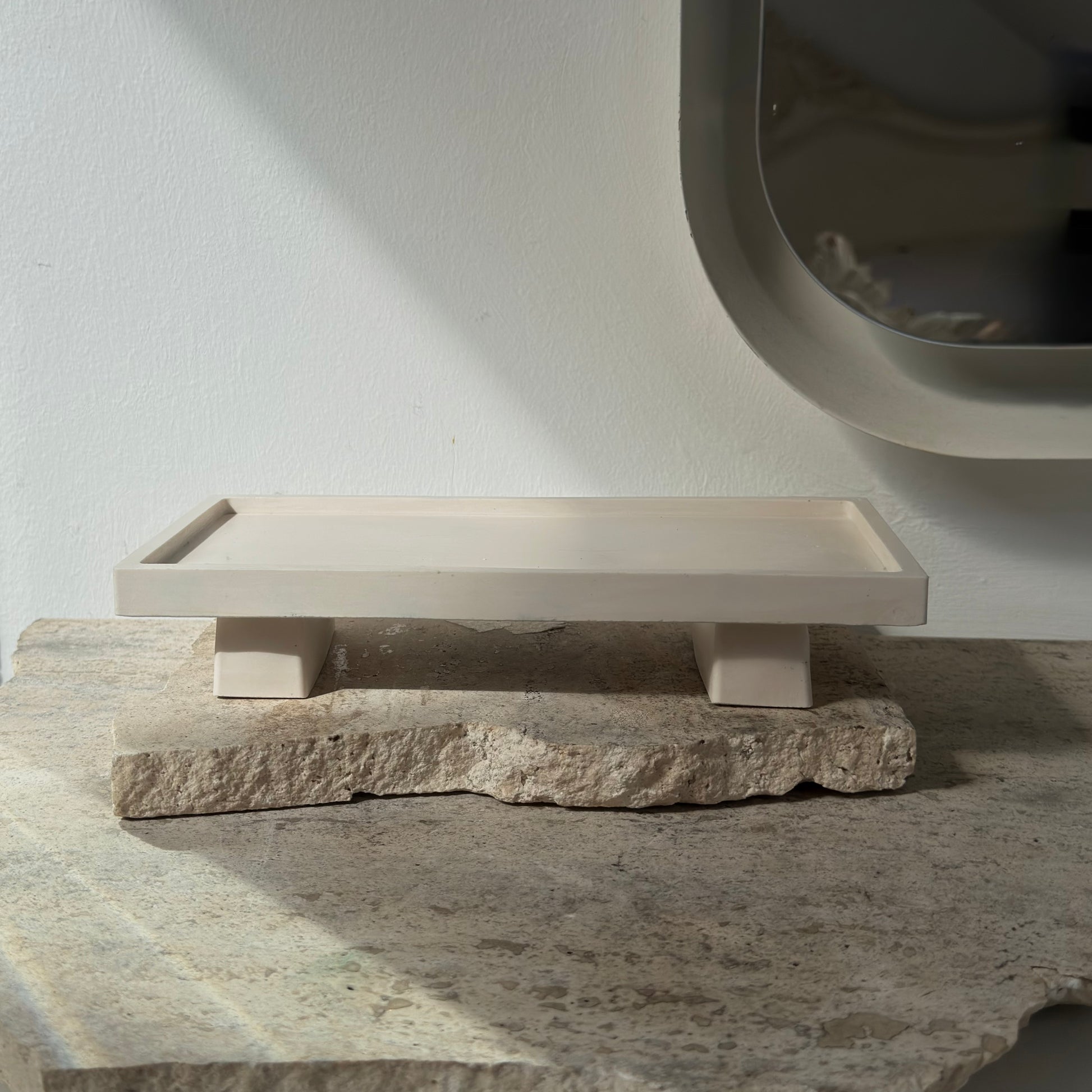 almo Home Poise Rectangle raised decorative plinth empty on a stone surface, front view showing two architectural legs