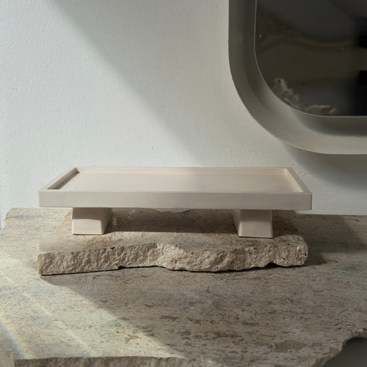 almo Home Poise Rectangle raised decorative plinth empty on a stone surface, front view showing two architectural legs