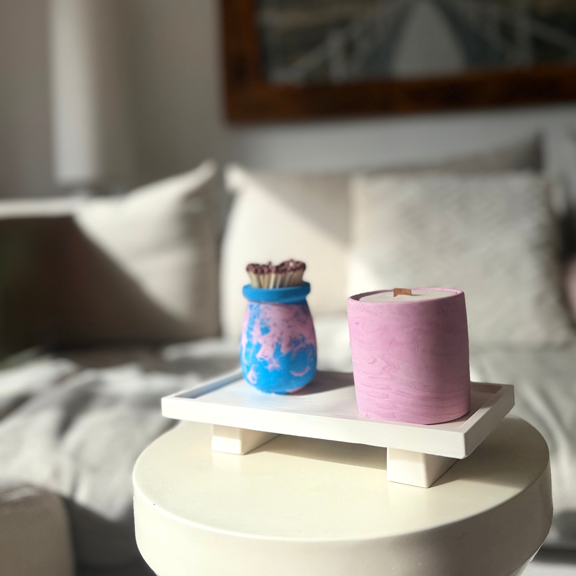 Malmo Home Poise Rectangle plinth with a pink candle pot and marbled match holder in natural light