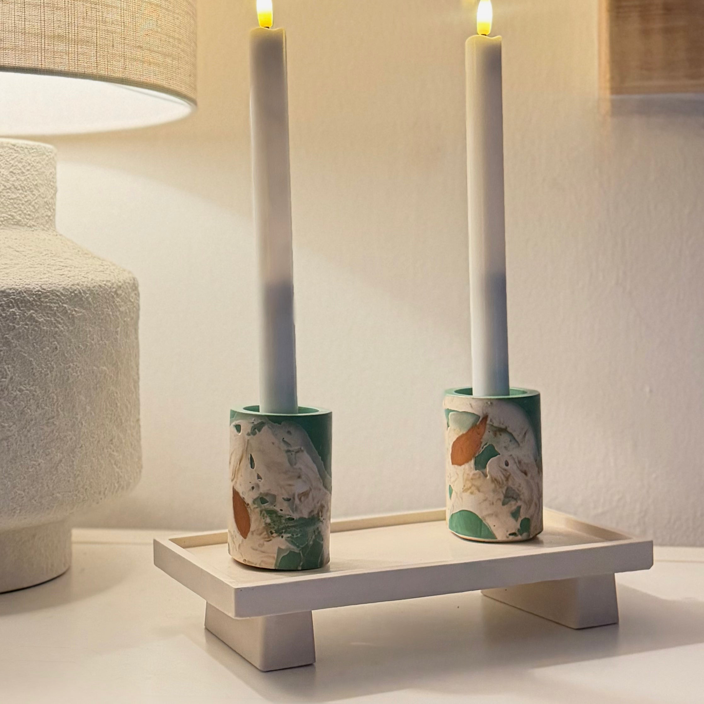 Malmo Home Poise Rectangle plinth styled with a pink candle pot and marbled match holder on a coffee table