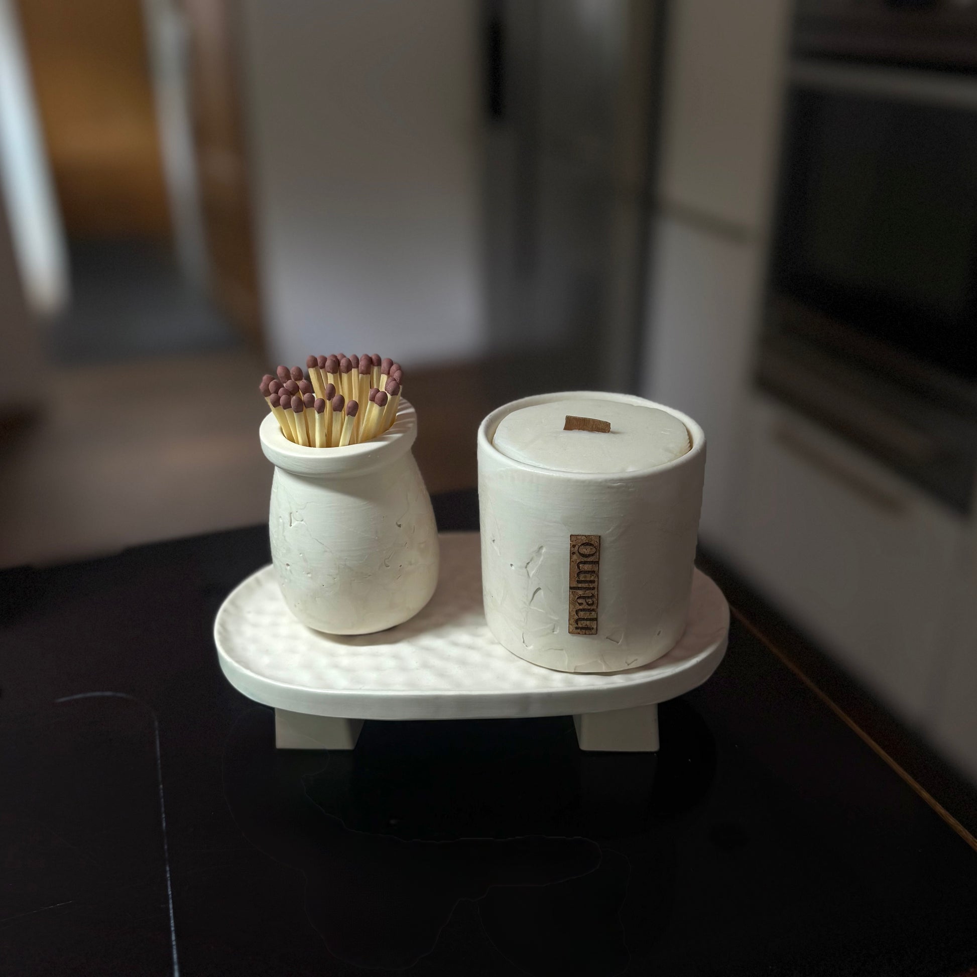 Malmo Home Poise Oval plinth styled with a candle pot and match holder in a kitchen setting
