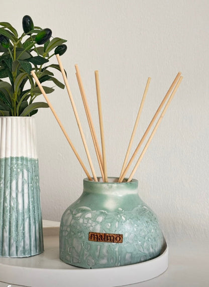 Refillable Dröm Diffuser in warm sage green with 8 reeds and 250ml scented oil for home fragrance
