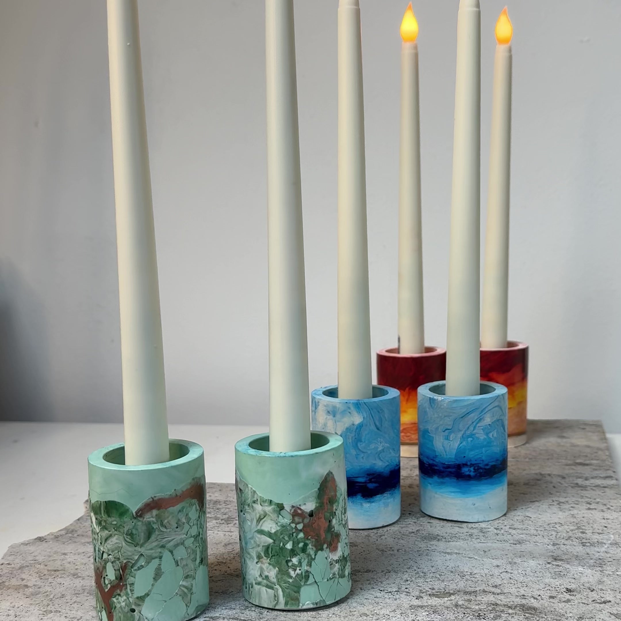 Load video: Handmade candlesticks in Leaf, Sky and Sun finishes.