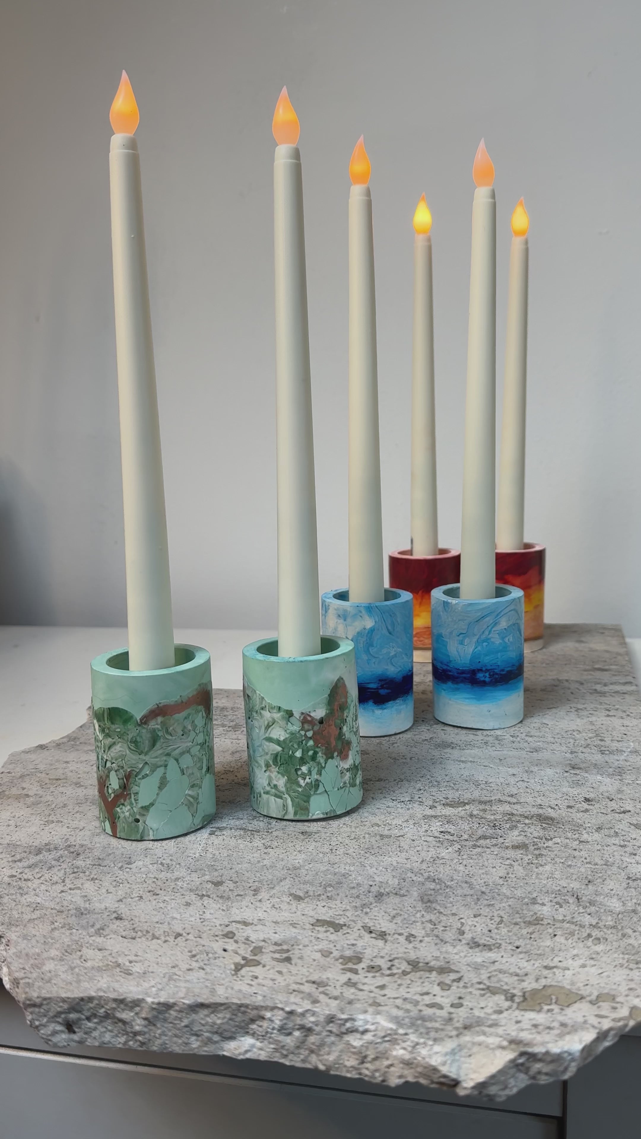 Load video: Handmade candlesticks in Leaf, Sky and Sun finishes.